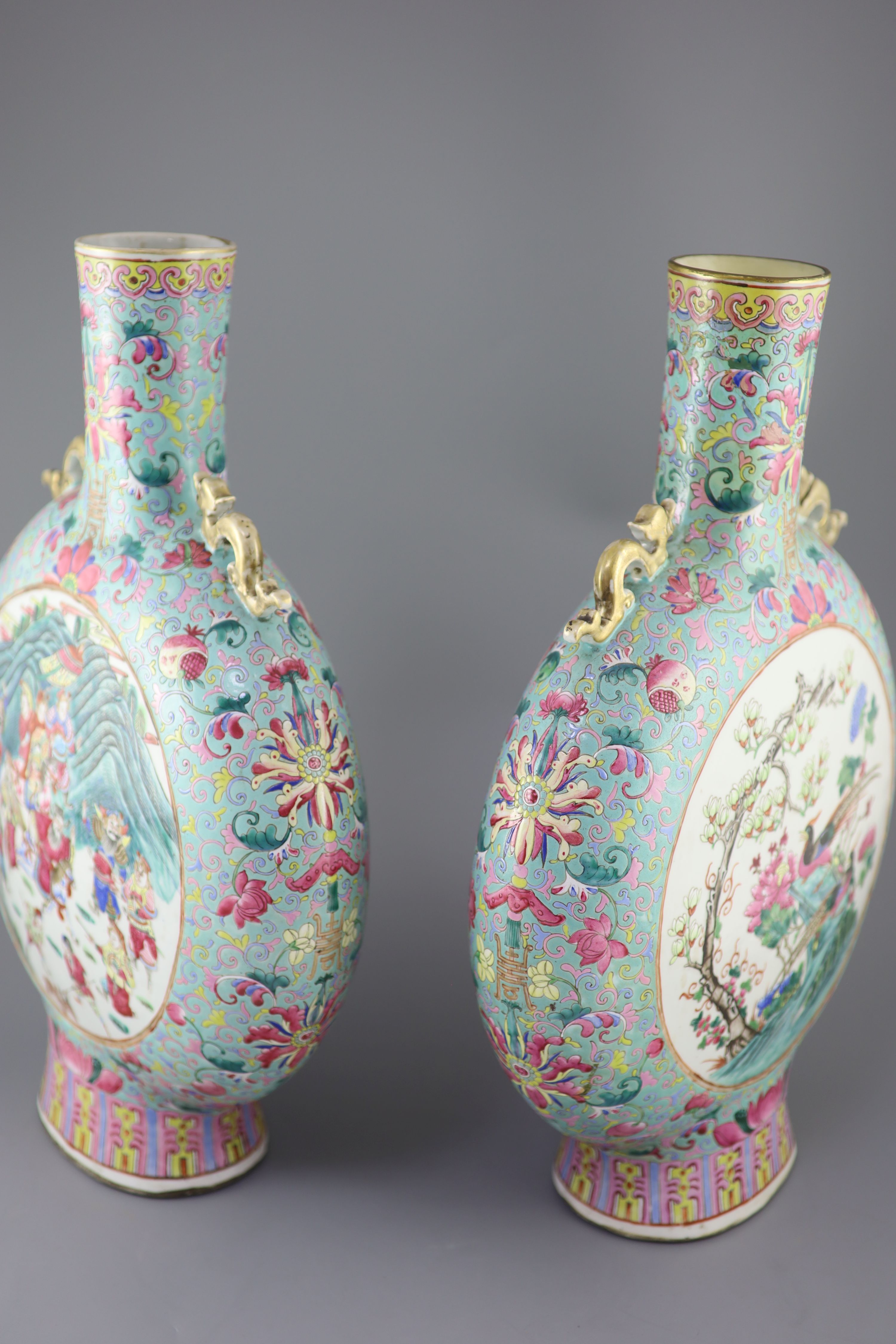 A pair of large Chinese turquoise ground famille rose moon flasks, Tongzhi seal mark and of the period (1862-74), 51cm high, Provenance